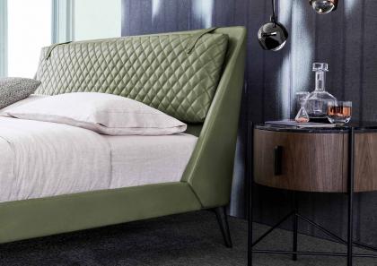 Bedroom furnished with Chelsea bed in leather, Roi bedside tables, small Circus table and Patti armchair - BertO