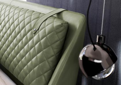 Detail of the quilted headboard cushion of the luxurious, modern Chelsea double bed in leather - BertO