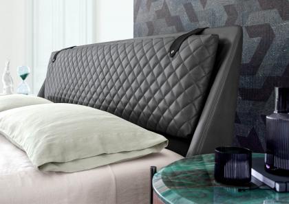 Detail of the quilted headboard of the modern Chelsea double bed in leather - BertO