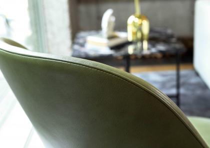 Detail of KIM green leather enveloping armchair backrest - BertO