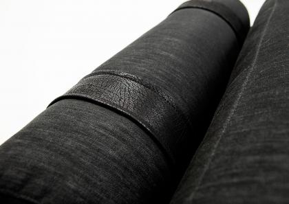 Backrests supported by soft roll cushions linked to the structure by fine belts made of black Nabuk leather - Joey #Bert