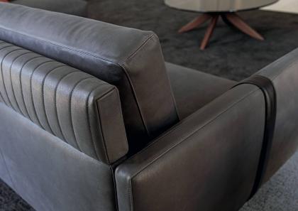 The backrest of the sofa is enriched by a quilted headrest which makes this exclusive model unique - BertO